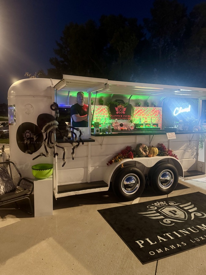 Jackpot trailer at twilight styled with seasonal florals over the bar