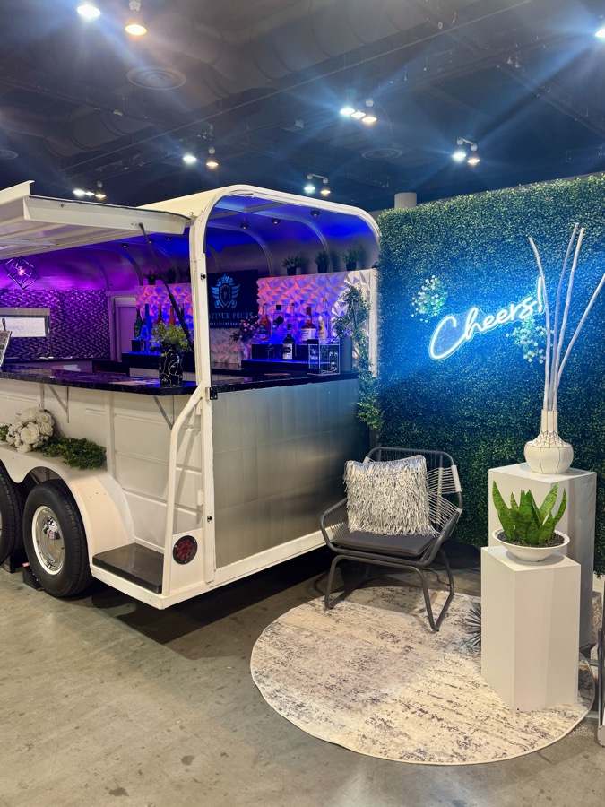 Jackpot bar trailer with greenery, LED-lit interior and floral arrangements ready for service