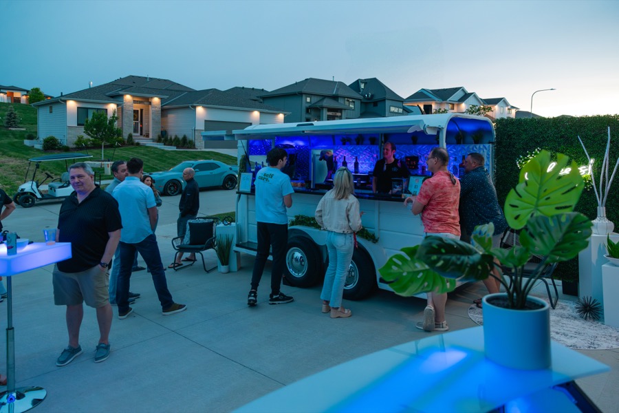 Jackpot bar trailer at twilight with cool blue LED interior lighting