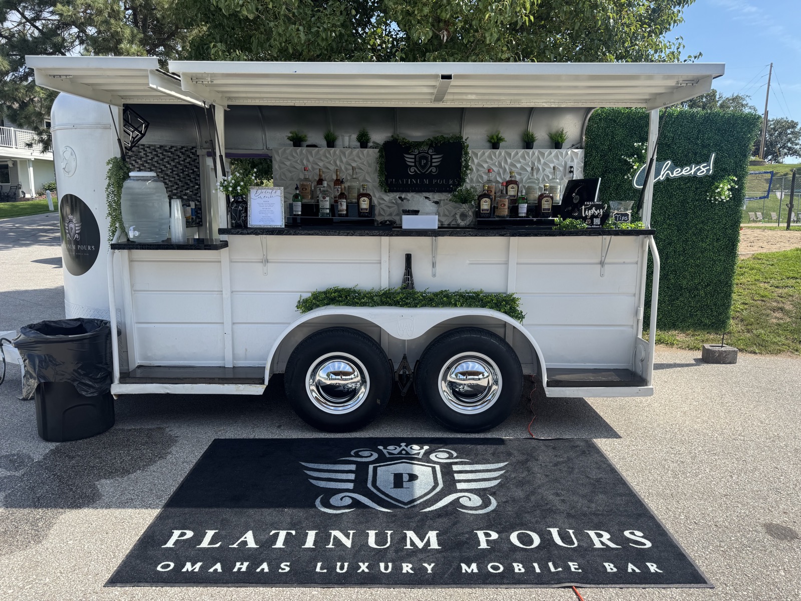 Platinum Pours' Solo Jackpot 17 ft luxury mobile bar trailer, branded floor mat in front