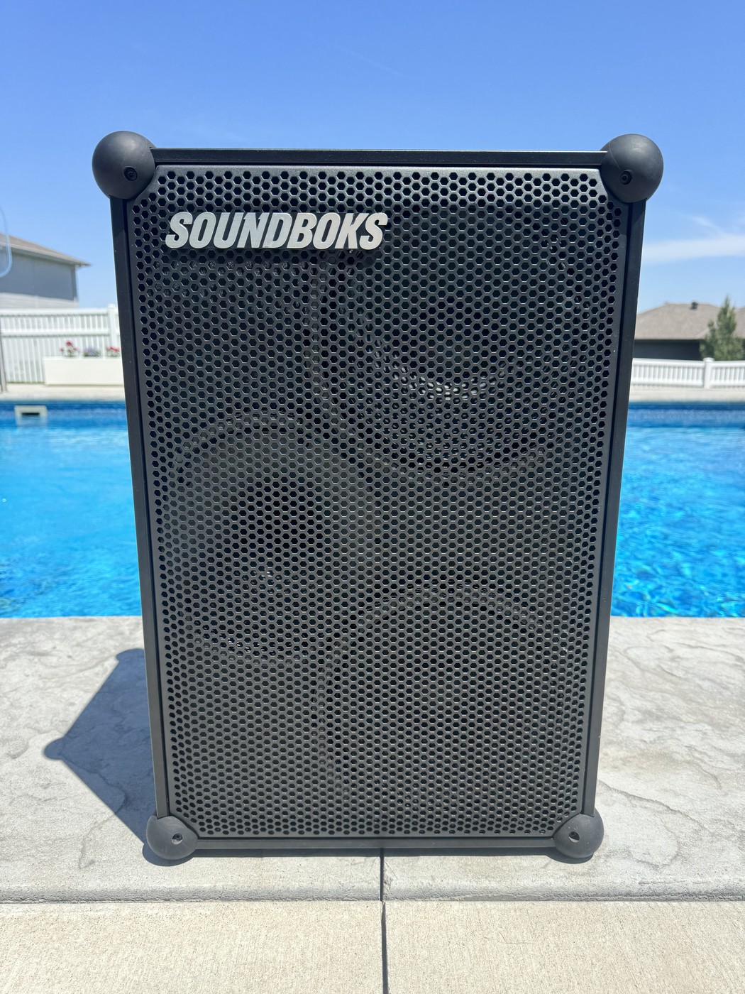 MEGA Soundboks high-powered battery-operated Bluetooth speaker set up poolside, ready for an outdoor event